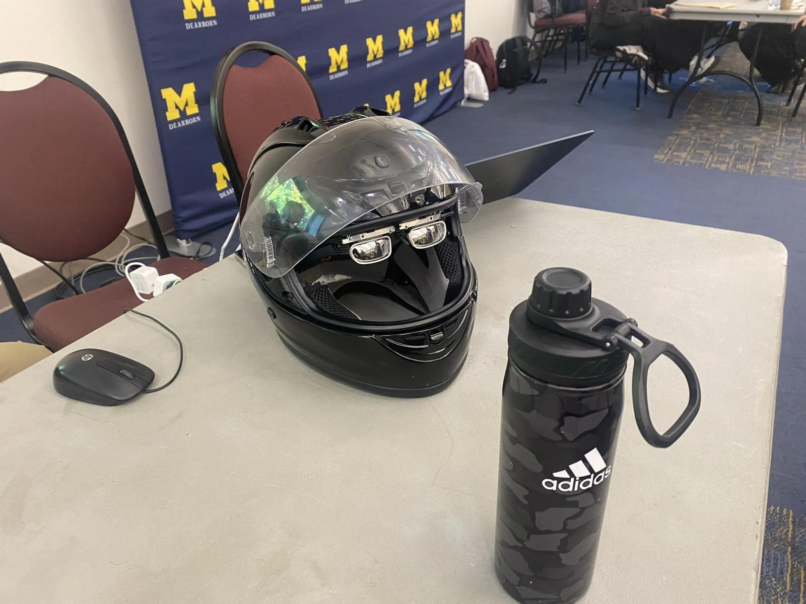 The helmet and glasses on a table at the hackathon