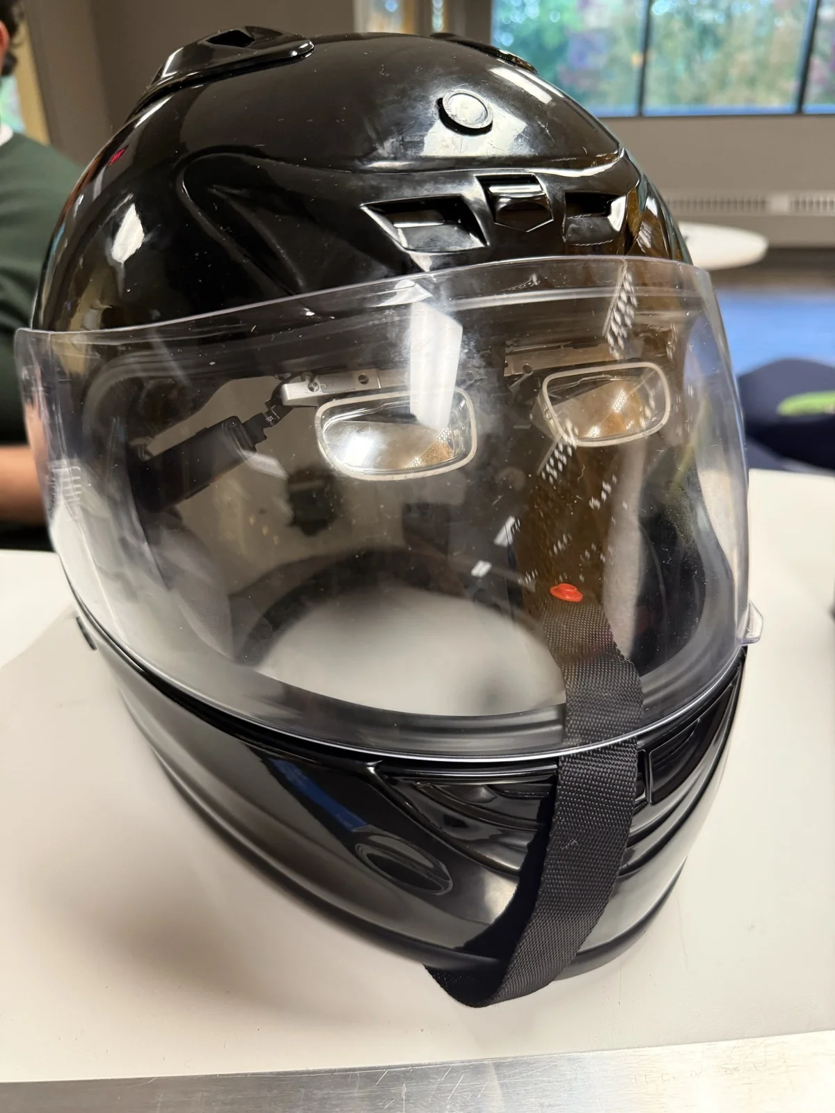 XREAL glasses fitted inside the motorcycle helmet at the hackathon