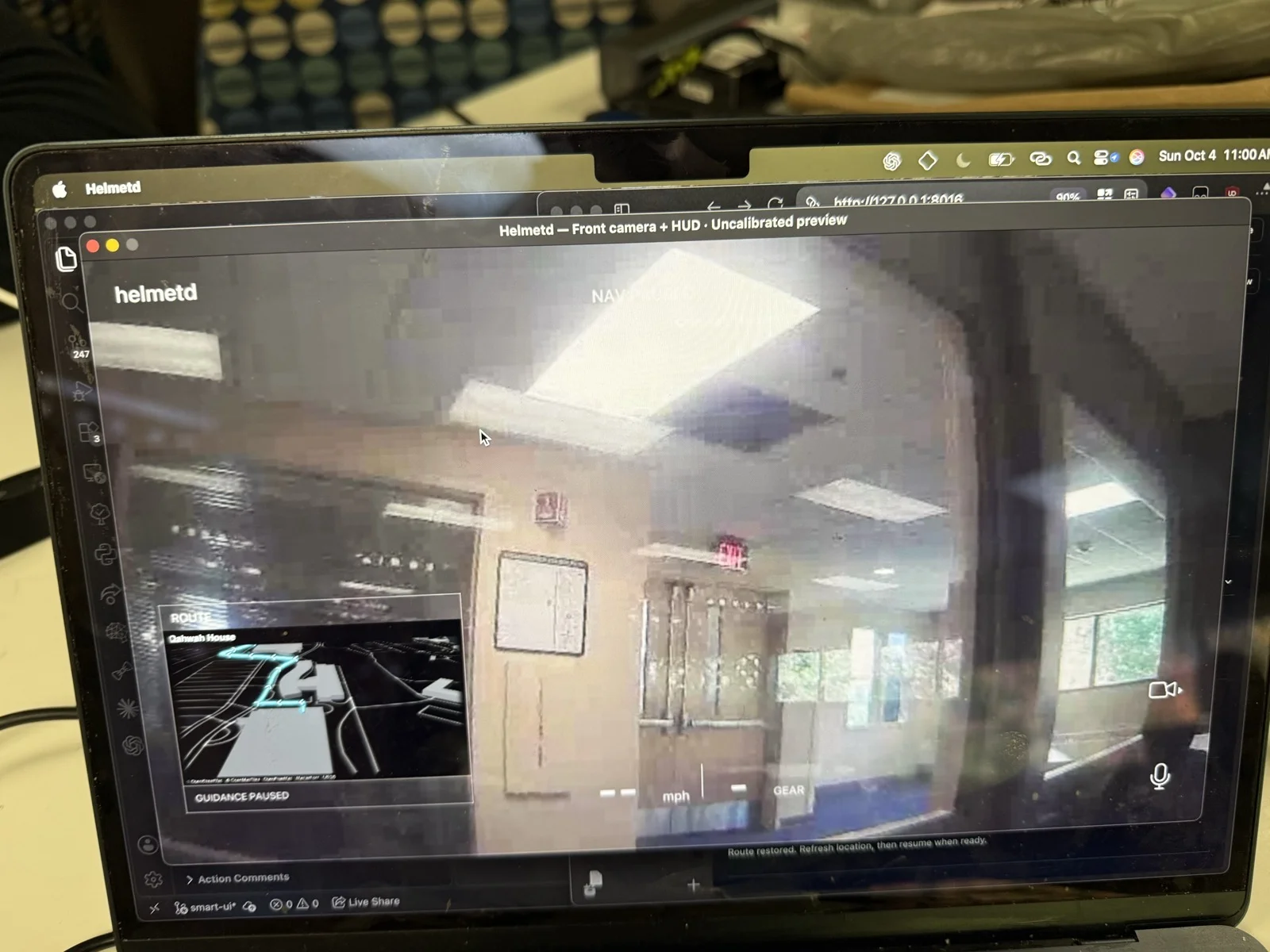 Camera feed and navigation HUD preview on the MacBook